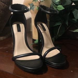 Beautiful strapped black leather heels. 5” heel